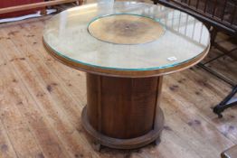 1930's circular mahogany cocktail table having central elevating compartment, 60cm by 76cm diameter.