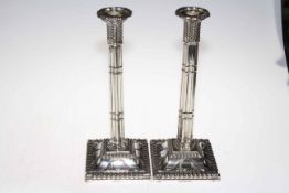 Pair silver plated column candlesticks, with detailed decoration and bead border, 32cm.