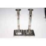 Pair silver plated column candlesticks, with detailed decoration and bead border, 32cm.
