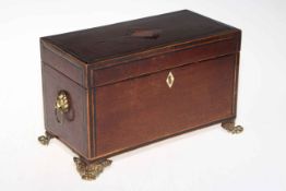 Inlaid mahogany two compartment caddy on brass feet.