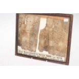 Two 17th Century fragments of documents found at 16 Briggate, Leeds, framed.