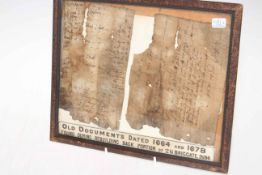 Two 17th Century fragments of documents found at 16 Briggate, Leeds, framed.