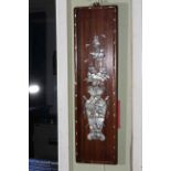 Pair Oriental rosewood and mother of pearl inlaid wall plaques depicting vases of flowers,