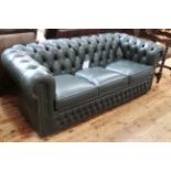 Green deep buttoned leather three seater Chesterfield settee.