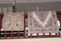 Two similar floral needlework rugs (largest 1.50 by 0.88).