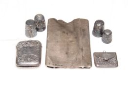 Victorian silver engraved vesta case, silver stamp holder, card case and four thimbles.