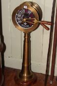 Brass ships telegraph, the circular top with alternating lever and speed dial on tapered stand.