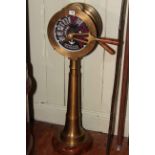 Brass ships telegraph, the circular top with alternating lever and speed dial on tapered stand.