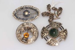 Collection of four Scottish and other silver brooches.