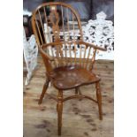 Windsor pierced splat back elbow chair with crinoline stretcher stamped John Harrison, Great Ayton.