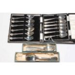 Two sets of cased silver teaspoons and another set of six and four teaspoons.