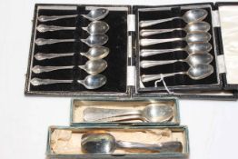 Two sets of cased silver teaspoons and another set of six and four teaspoons.