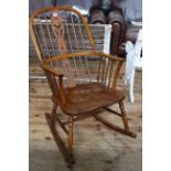 Windsor pierced splat back rocking chair.