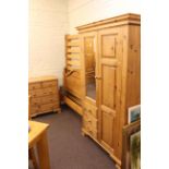Three piece pine bedroom suite comprising combination wardrobe,