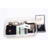 Box with silver toothpick, Cartier wristwatch, gold ring and Mary pendant,