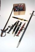 Collection of replica five daggers and two swords, medals, etc.