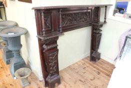 Late 19th/early 20th Century carved oak fire surround, 129cm by 165cm by 30cm.