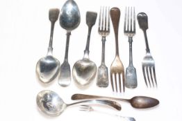 Silver flatware including fiddle pattern dessert spoons and forks and sauce ladle.