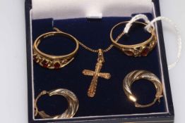 Two 9 carat gold garnet rings, gold cross pendant, earrings and fine chain.