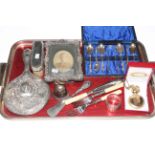 Silver backed brush and mirror, silver photograph frame, silver plated spoons, forks and knife,