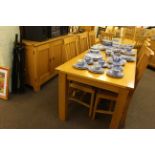 Light oak eight piece dining suite comprising three door sideboard,