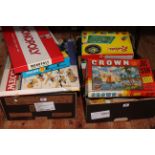 Two boxes of games and toys including Meccano, Rapier Mobile Crane, model vehicles, etc.