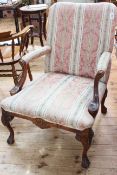 Open armchair on cabriole legs to claw feet in classical striped fabric.