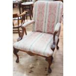 Open armchair on cabriole legs to claw feet in classical striped fabric.