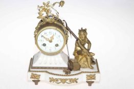 Gilt metal mounted marble mantel clock with cherub figure.