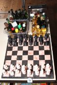 Marble chess set and board, and collection of spirit miniatures.