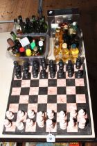 Marble chess set and board, and collection of spirit miniatures.