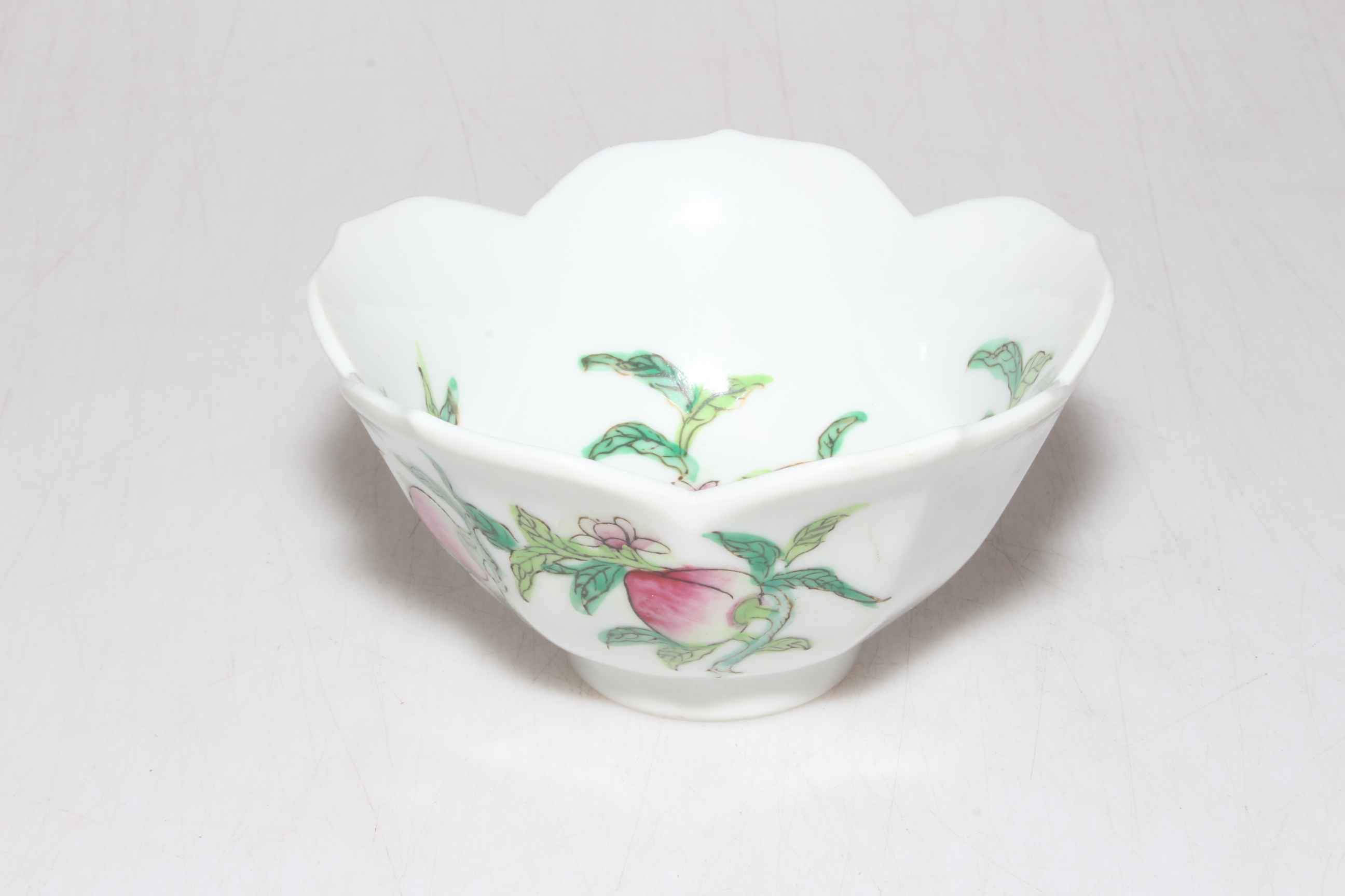 Small Chinese porcelain bowl with peach decoration, 12cm diameter.