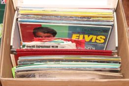 Box of LP records and singles.