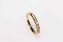 18 carat yellow gold seven stone diamond ring, size P.