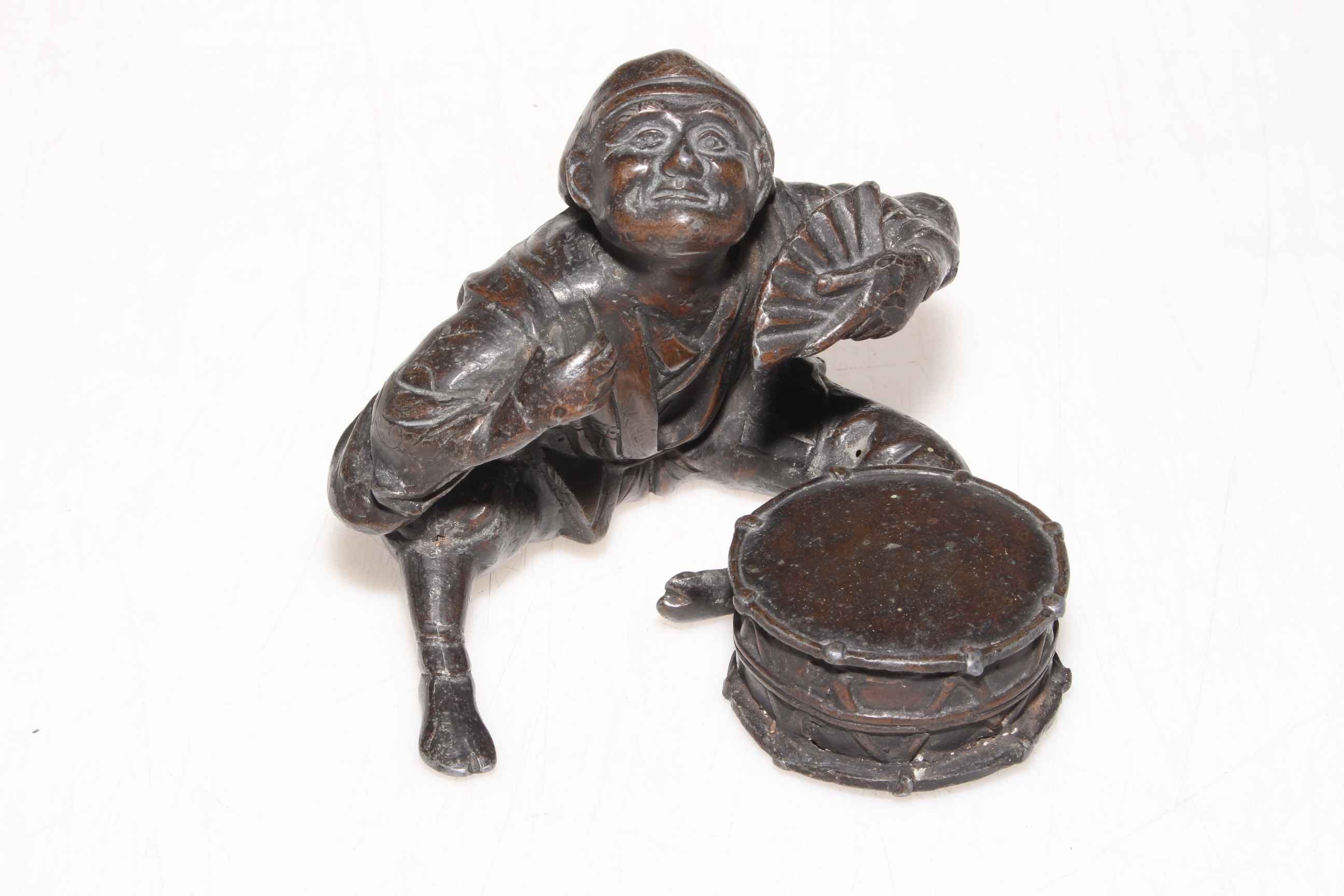 Japanese Meiji period bronze of an actor with fan and drum.