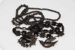 Two Whitby Jet necklaces and two brooches.