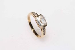 White rectangular stone ring set in 9 carat yellow gold, size N.