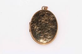 Engraved 9 carat gold oval locket.
