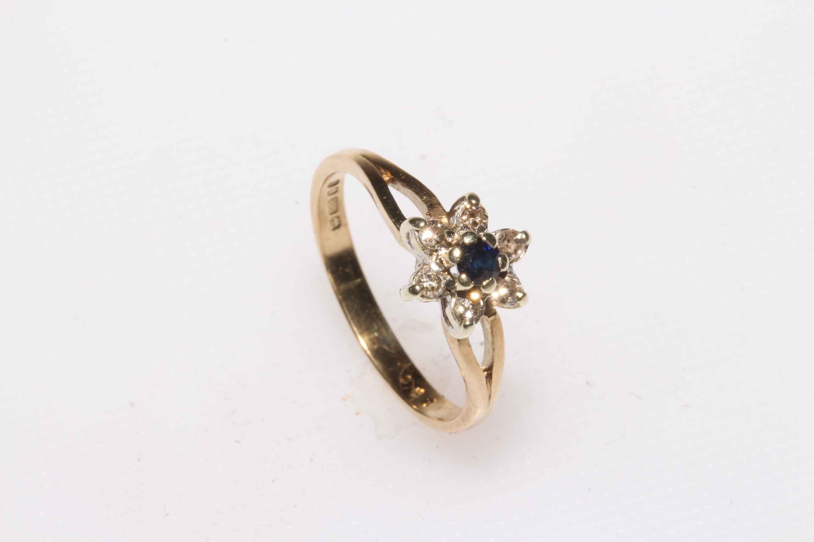 9 carat gold, sapphire and diamond petal design cluster ring, size O.