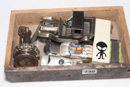 Collection of vintage and novelty cigarette lighters.