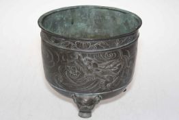 Chinese bronze planter decorated with embossed and engraved dragon raised on three masked feet,