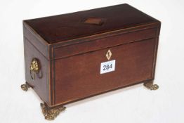 19th Century inlaid mahogany two compartment tea caddy raised on brass paw feet with lion mask