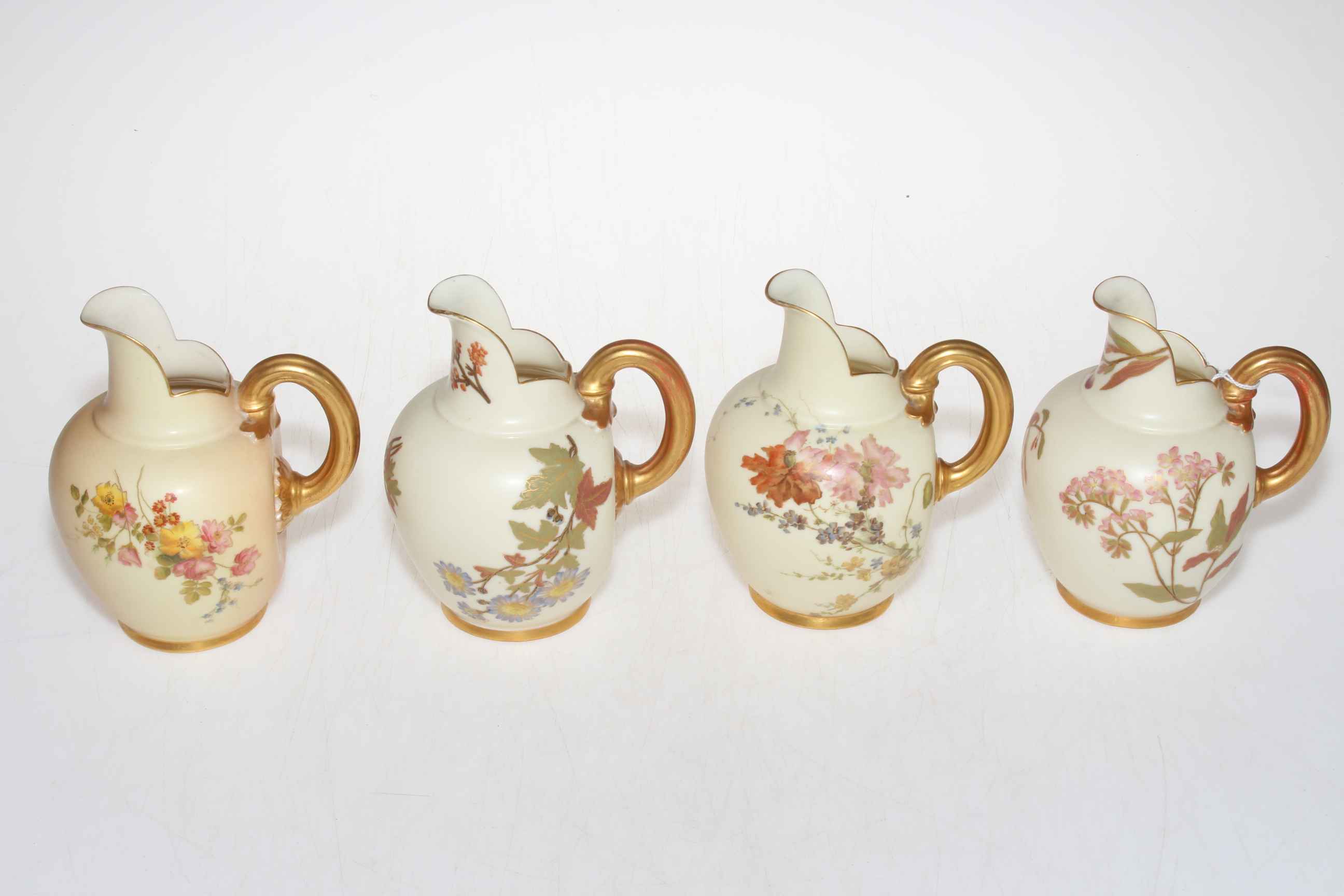 Four Royal Worcester flat back jugs '1094'.