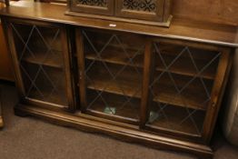 Oak leaded glazed three door bookcase and oak entertainment stand (2).