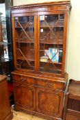 Mahogany cabinet bookcase having two astragal glazed doors above two drawers with cupboard doors