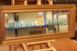 Rectangular pine framed wall mirror marked Rowntrees Chocolates, 36.5cm by 82cm including frame.