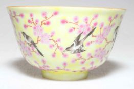 Small Chinese Famille Rose and bird decorated tea bowl with six character mark to base.