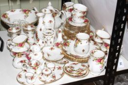 Royal Albert Old Country Roses including teapot, approximately 50 pieces.