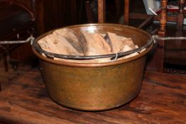 Copper log bin with swing handle, 28cm high.