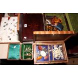 Five various wooden boxes containing costume jewellery including earrings, brooches, etc.